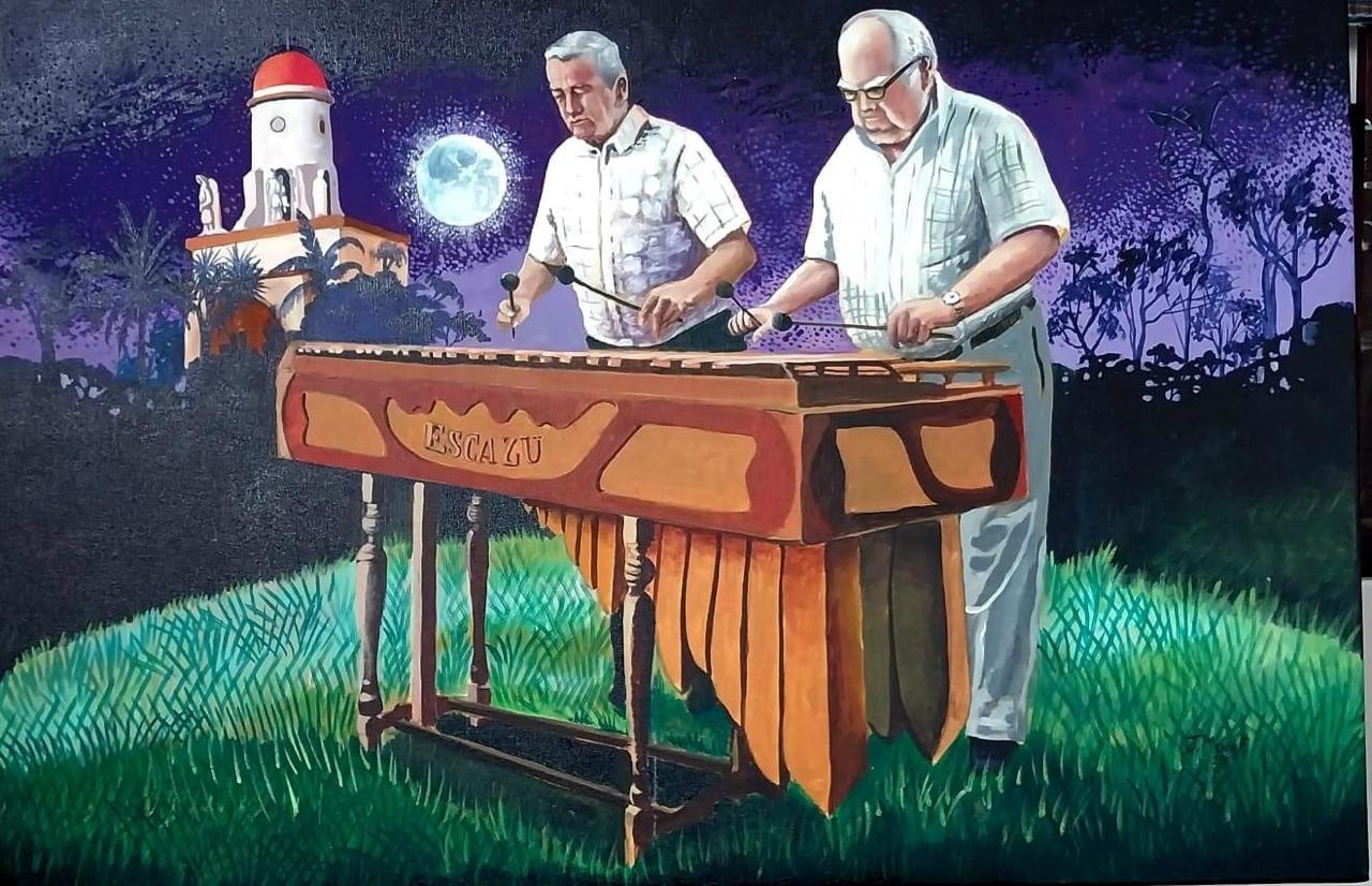 Pintura de dos marimbistas tocando frente a la iglesia de Escazú de noche